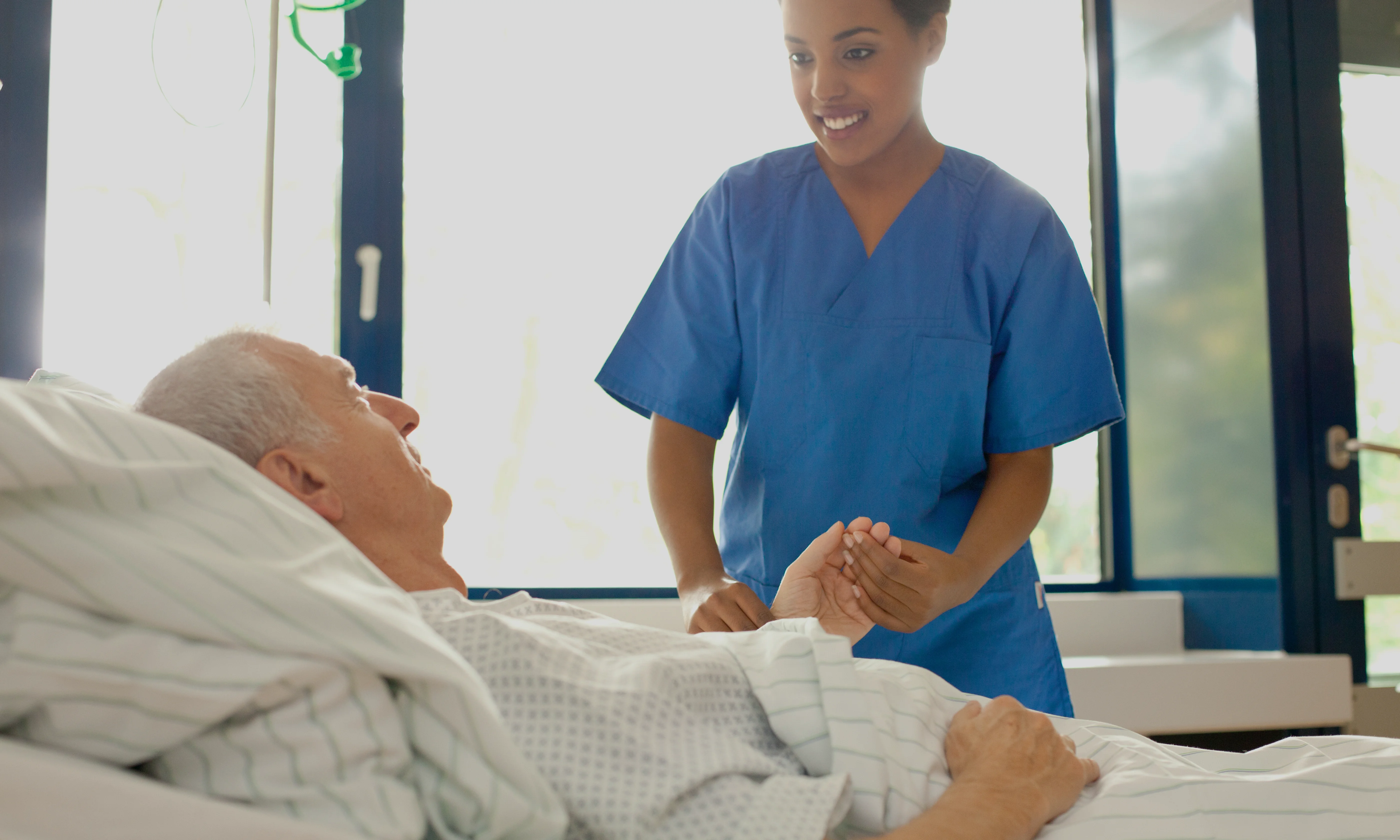 Nurse looking after patient in a hospital