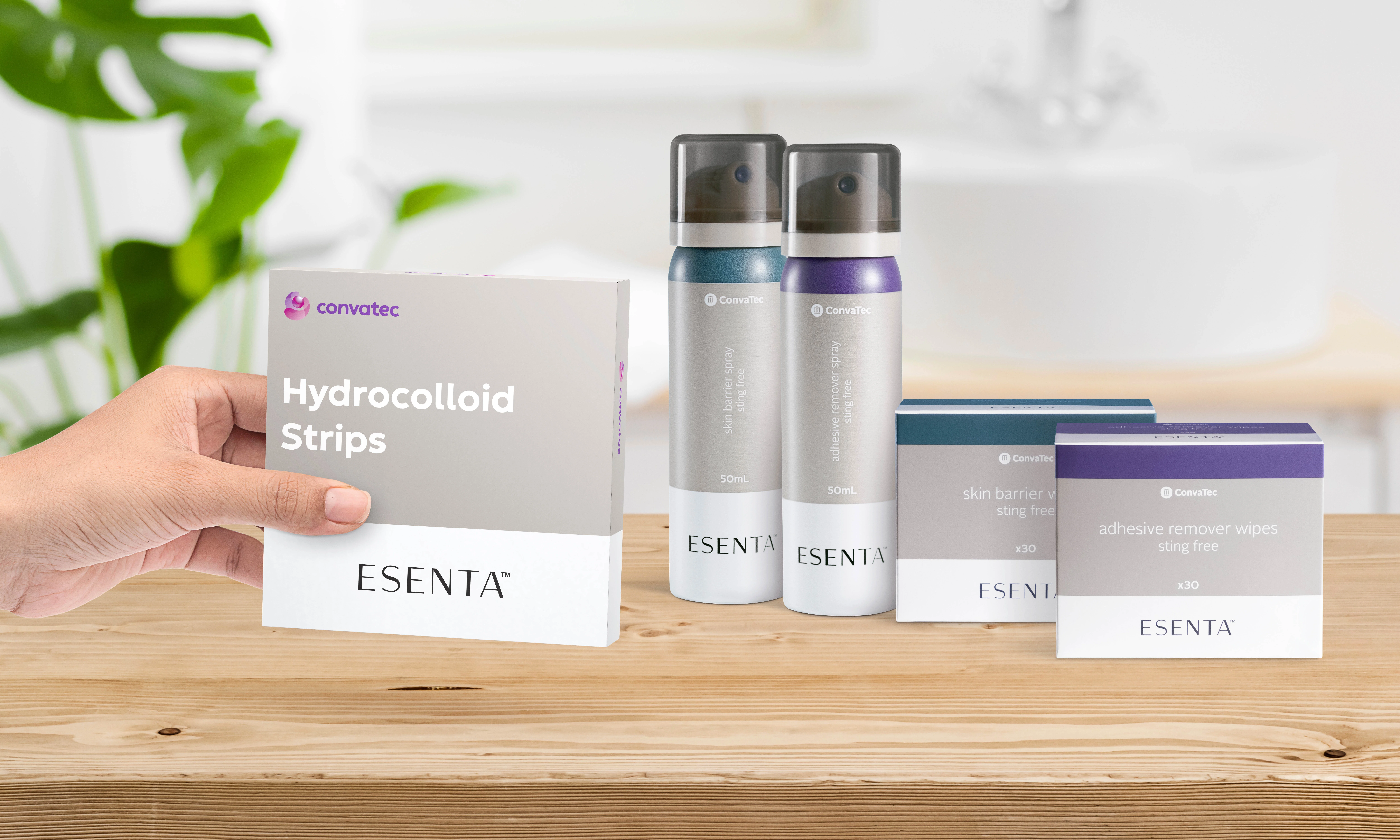 a hand holding a product box